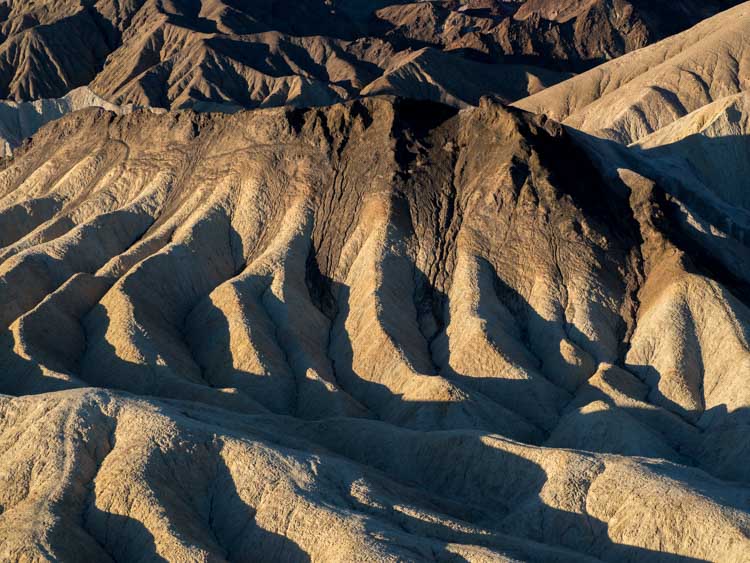 Death Valley National park: Zabriskie point at dawn with shadows