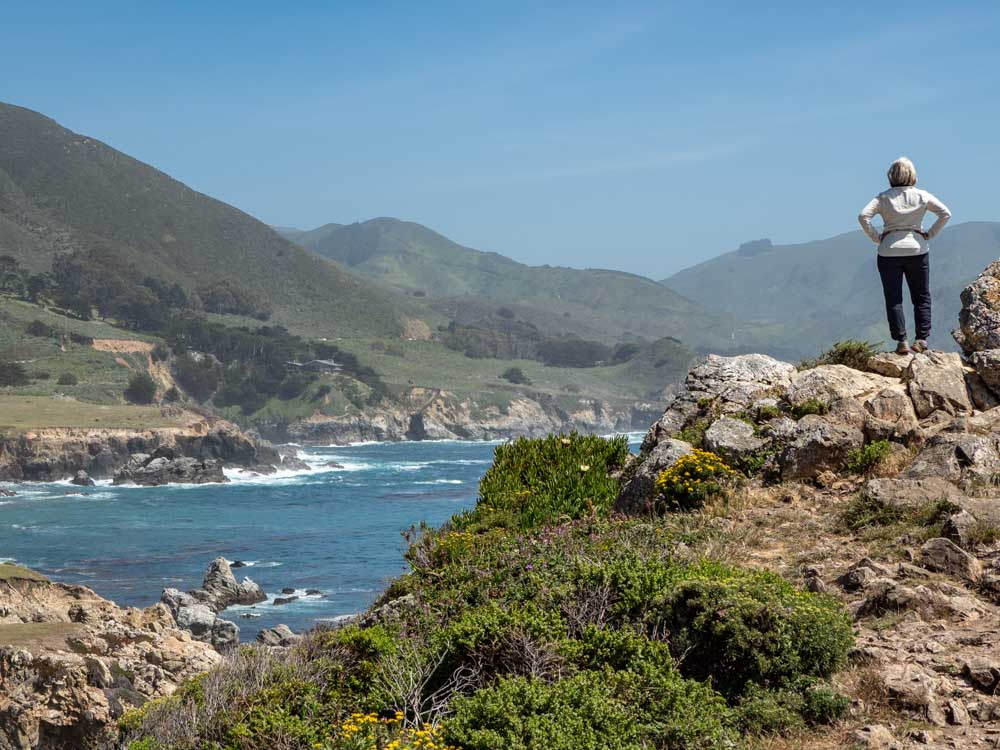 Big Sur coastal drive: Rocky Point. Woman and coastline