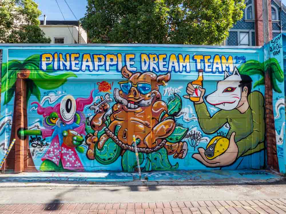 San Francisco Mission Murals: Pineapple Dream Team Nite Owl Ham and Sidy mural with cartoon characters. 