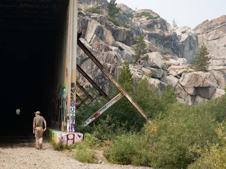 Truckee Tahoe Donner Tunnels exterior with man