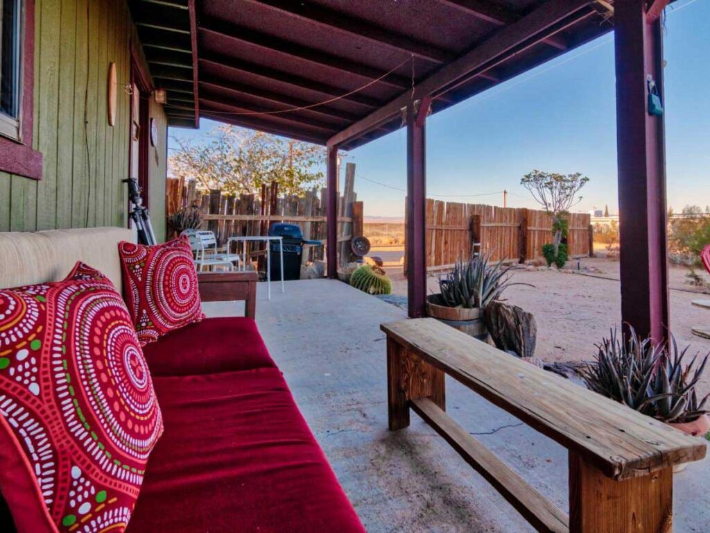 Joshua Tree Starfire Cabin retreat. couch and covered porch
