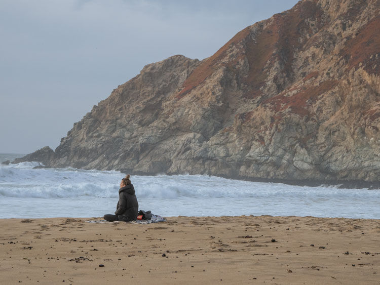 Grey Whale Cove state beach woman chilling on beach