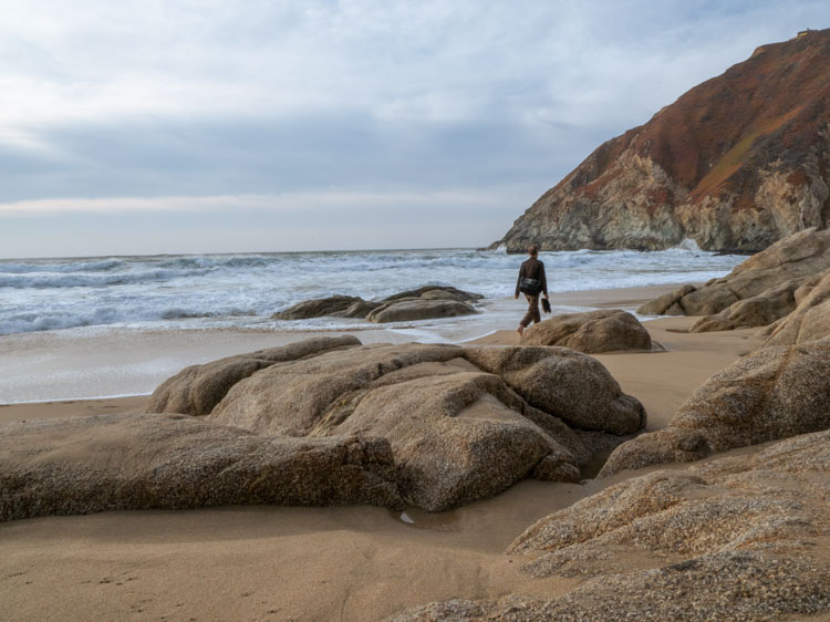 Grey Whale Cove beach rocks and beachcomber