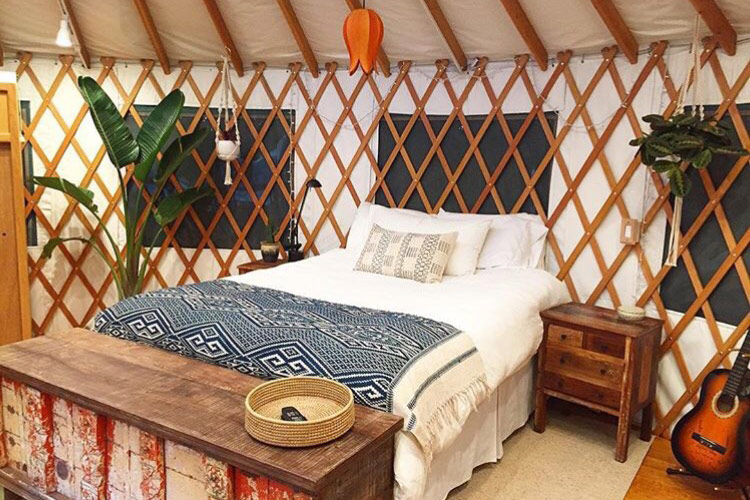 Santa Cruz glamping mountain top yurt. bedroom with wood slats