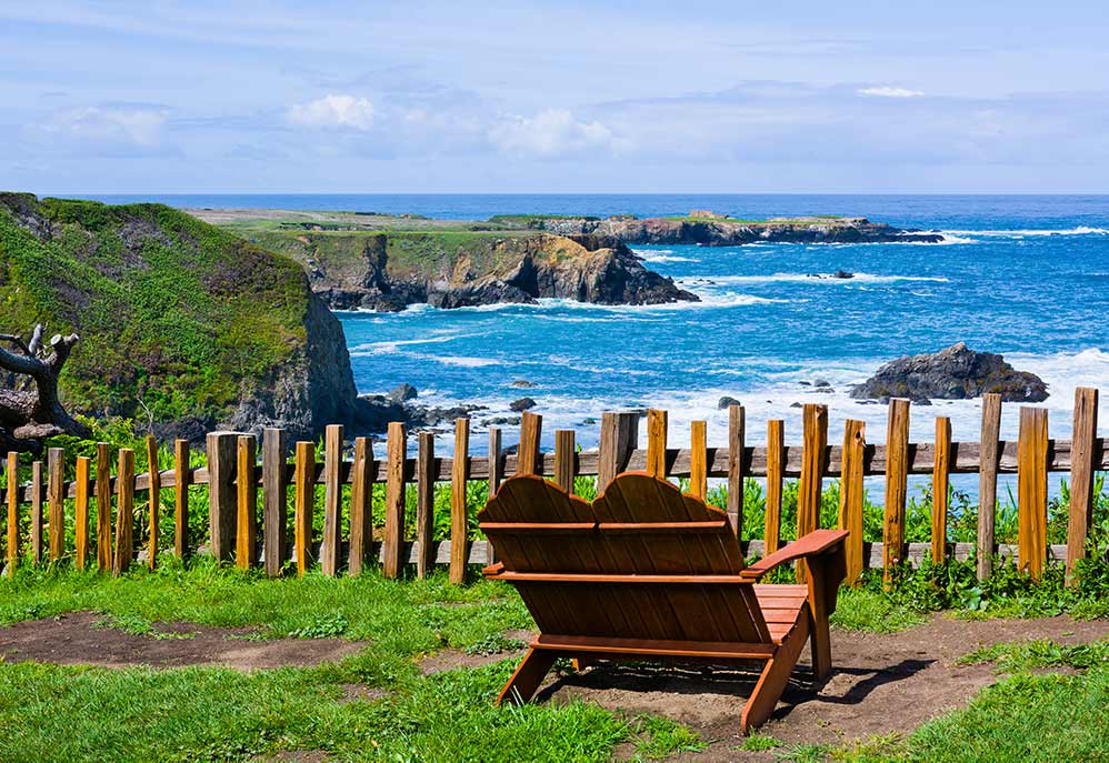 Mendocino coastal view. chair and cliff overlooking ocean