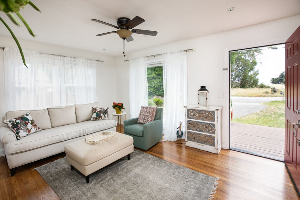 Surfer's Paradise beach house rental in Santa Cruz. living room with white furniture