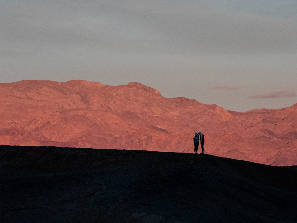 Death Valley sunrise couple on Mesquite Dunes
