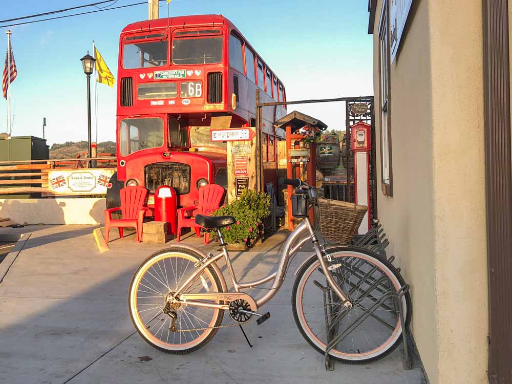 Cameron's pub in Half Moon Bay exterior with red bus and bike