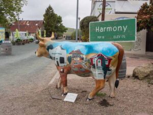 Harmony California sign and cow sculpture