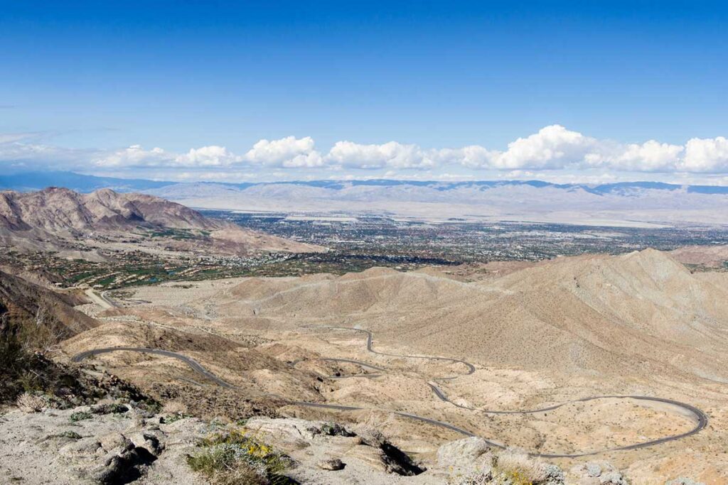 Palms to Pines scenic highway in California. desert landscape and curby road