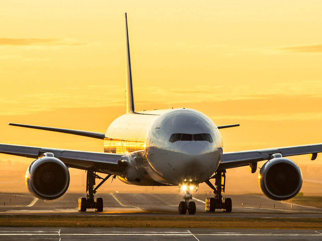 aircraft landing sunset