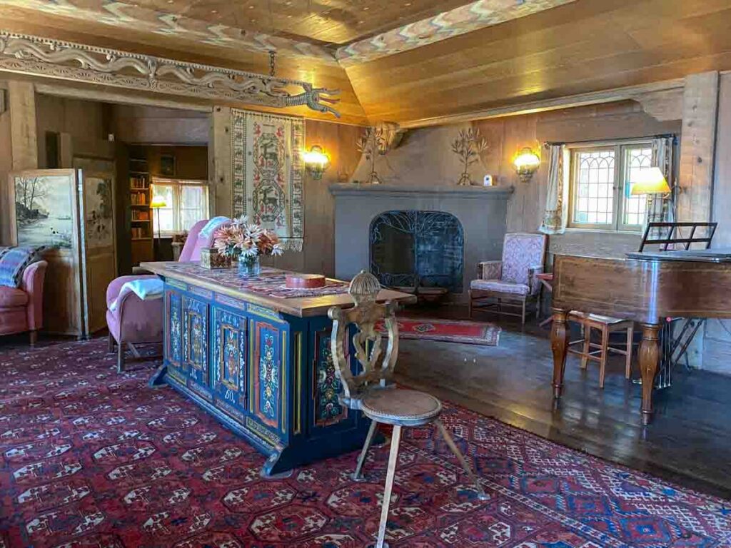 Interior of Vikingsholm living room. Painted furniture and chairs