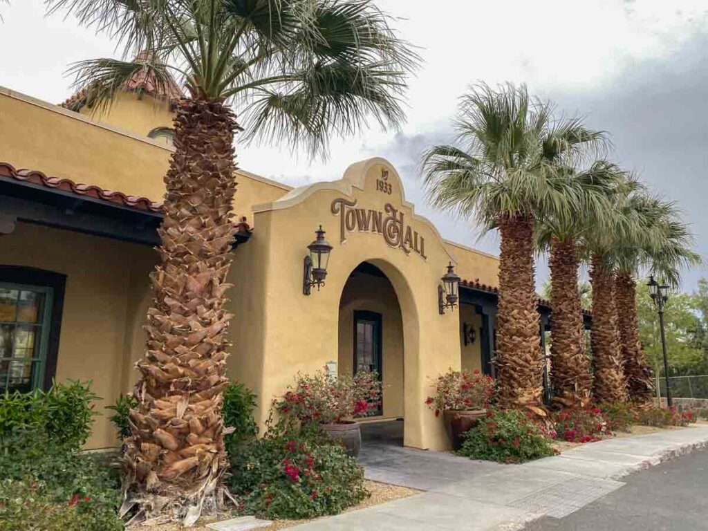 The Ranch at Death Valley reception. Adobe building and palm trees