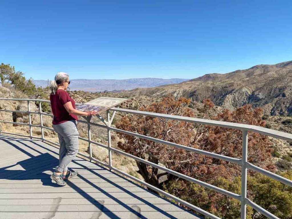 Palm to Pines Cahuilla Tewanet vista point. woman overlooking desert