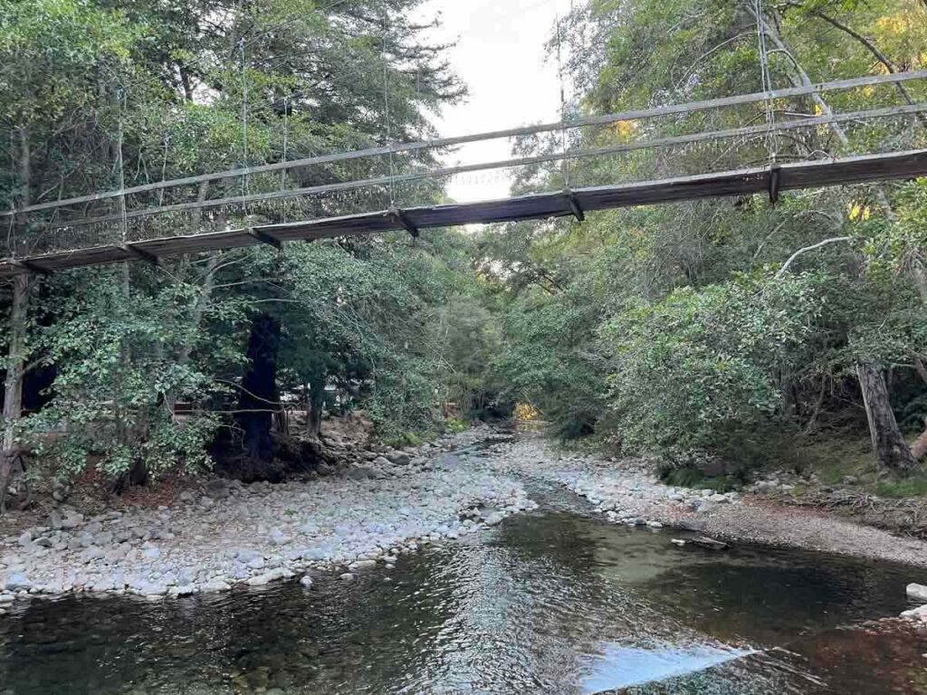 Riverside campground in Big Sur with footbridge