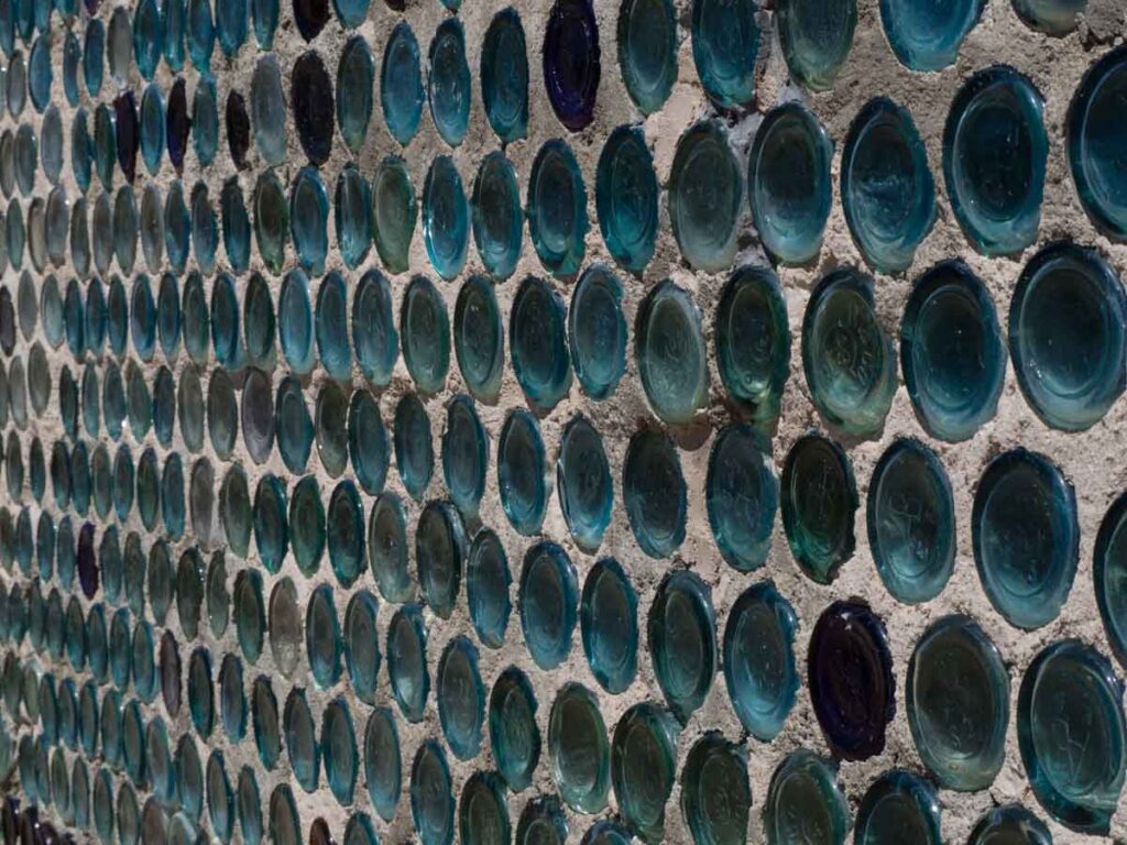Tom Kelly Bottle House glass wall