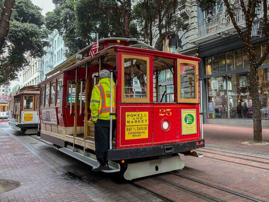 San Francisco cable car Powell St, with conductor.