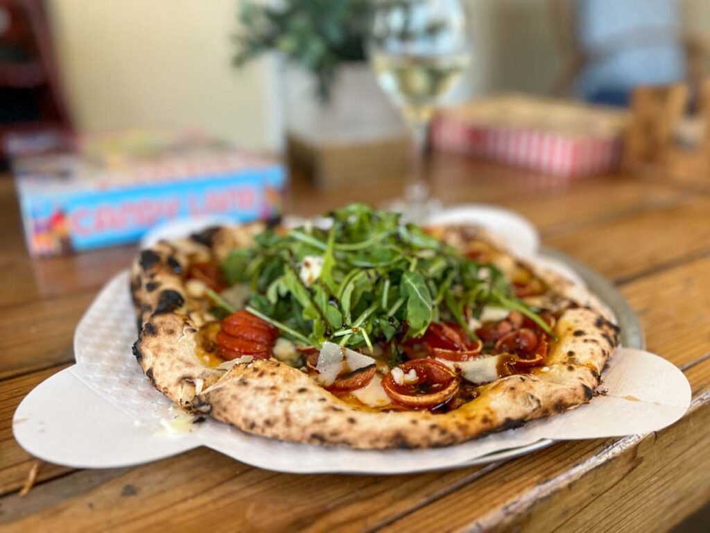 Palo Mesa pizza Pismo, wood fired pizza with arugula.
