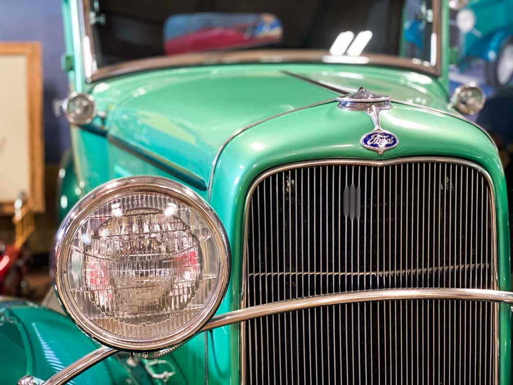 Car exhibit Estrella Warbirds museum, green Ford.